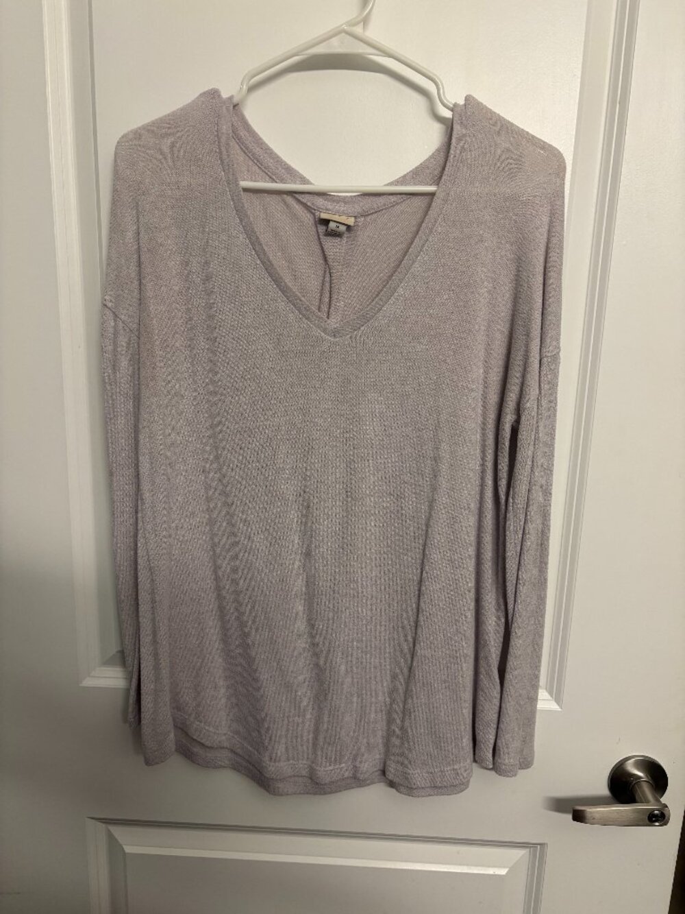 Light purple long-sleeve knit pullover top with a relaxed fit